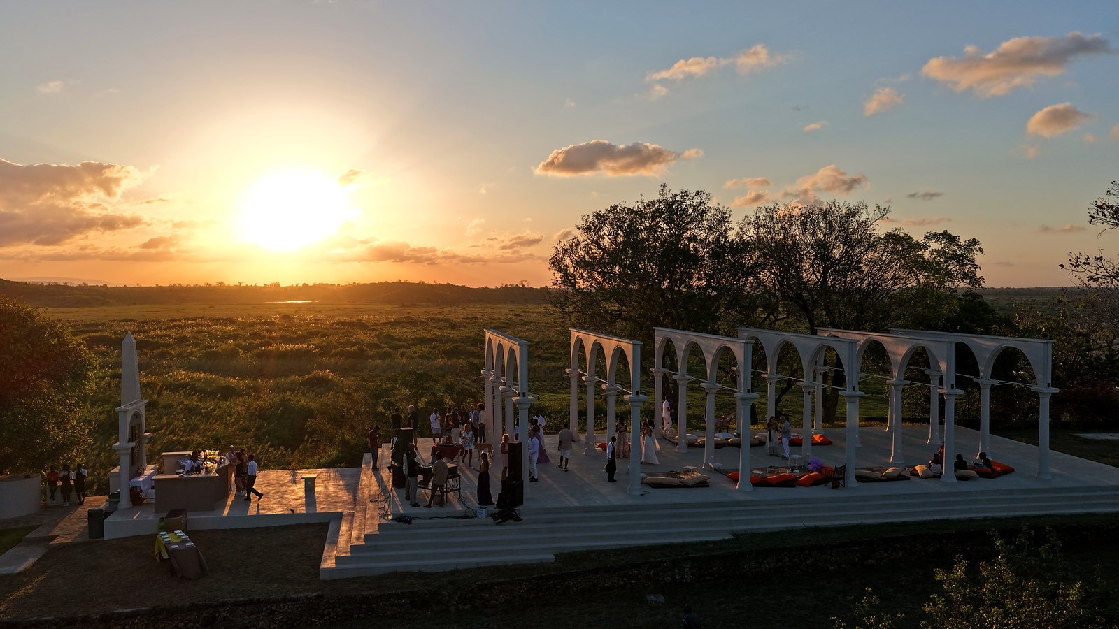 Guests gathering in the temple at sunset